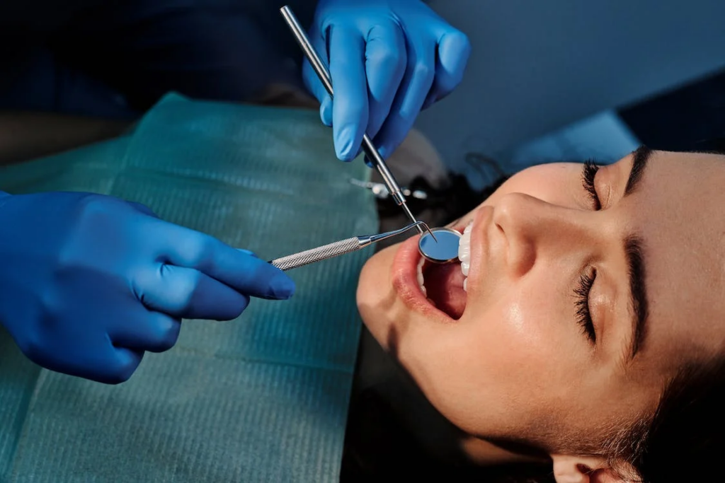 image of a person during a dental treatment with eyes closed
