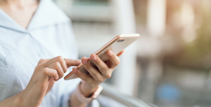 Closeup of patient looking at phone